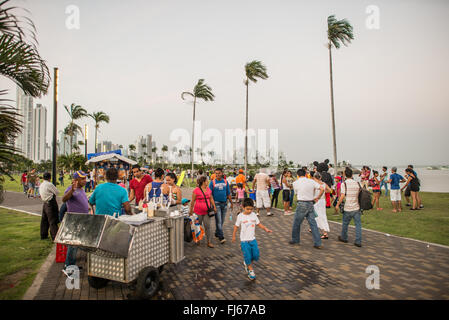 PANAMA CITY, Panama — People enjoying an evening stroll on the  waterfront boardwalk in Casco Viejo in Panama City, Panama. Stock Photo