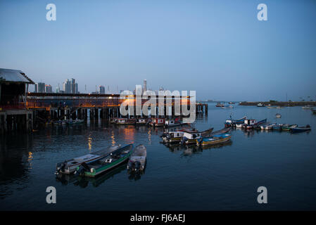 PANAMA CITY, Panama--Small fishing boats anchored in a small protected harbor on the waterfront of Panama City, Panama, on Panama Bay. Stock Photo
