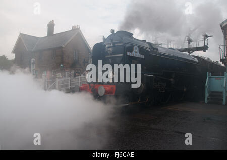 Tornado steam locomotive, BR blue, shrouded in steam Grosmont Station,  North York Moors Railway, blasting steam from cylinders Stock Photo