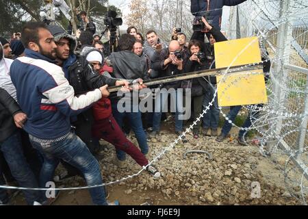 Idomeni, Greece. 29th February, 2016. Hundreds of migrants have tried today to break through the barrier that divides them from Macedonia , the police responded with tear gas and sound bombs after the migrants have managed to break through the fence on the railroad .Thousands of migrants are stuck at the border between Greece and Macedonia where only the Syrians and the Iraqis can pass , three groups per day  as they made their way towards the European Union. The Syrians migrants protest blocking the railway and demanding the immediate opening of the border . Credit:  AGENZIA SINTESI/Alamy Liv Stock Photo