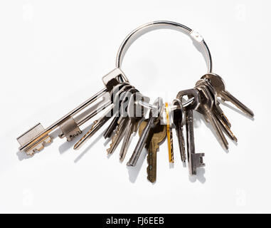 Large bunch of assorted small household or office keys on a metal ring in a safety ad security or ownership concept Stock Photo