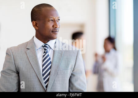 thoughtful afro American business man looking outside the window Stock Photo