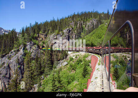 White Pass & Yukon Route Railroad heads into Tunnel Mountain Stock Photo