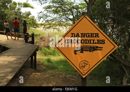 Crocodile warning signs at Saint Lucia, isimangaliso wetlands reserve,  KwaZulu-Natal, South Africa. Stock Photo