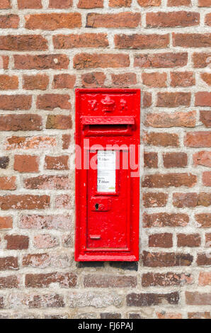 Bright red wall-mounted post box in Stourport-on-Severn Stock Photo