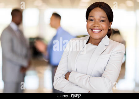 close up portrait of African America businesswoman at car dealership Stock Photo