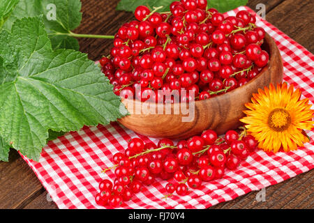 Currant berries in wooden bowl Stock Photo