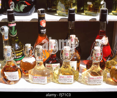 Bottles of local Grappa and liquors on stall, Assisi, Perugia Province, Umbria Region, Italy Stock Photo