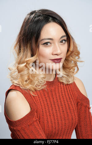 Young British Asian girl in studio setting, London, England, United Kingdom Stock Photo