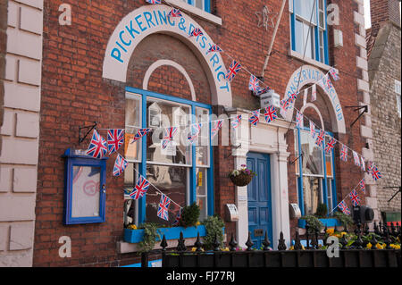 Exterior of the Pickering & District Conservative Club, Pickering, North Yorkshire, England - decorated in Union Jack bunting. Stock Photo