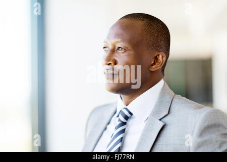 thoughtful African businessman in office Stock Photo