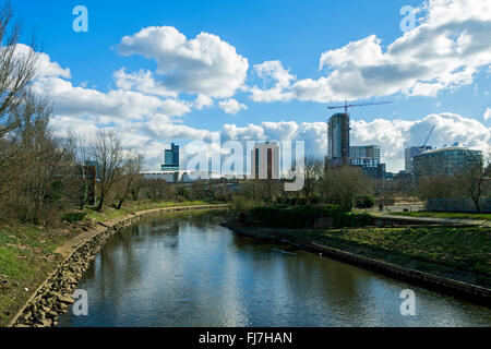 Manchester city centre skyline over the river Irwell,from Cottenham Lane footbridge, Salford, Manchester, UK Stock Photo