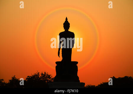Silhouette of Buddha Statue in Twilight Light. Stock Photo