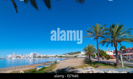 Mid morning sun on Ibiza waterfront.  Warm sunny day along the beach in St Antoni de Portmany Balearic Islands, Spain Stock Photo