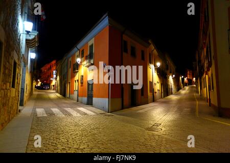 (160301) -- BRUSSELS, March 1, 2016 (Xinhua) -- Photo taken on Feb. 16, 2016 shows night view of the old town of Avila in Spain. The city of Avila is around 100 km to the north-west of Spain's capital city of Madrid. Founded in the 11th century to protect the Spanish territories from the Moors, this 'City of Saints and Stones', the old town of Avila has kept its medieval austerity. This purity of form can still be seen in the Gothic cathedral and the fortifications which, with their 82 semicircular towers and nine gates, are the most complete in Spain. The Old Town of Avila with its Extra-Muro Stock Photo