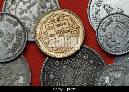 Coins of Nepal. Hindu trishul depicted in the Nepalese rupee coin. Stock Photo