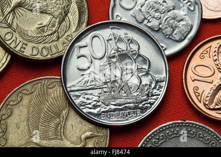 Coins of New Zealand. HM Bark Endeavour and Mount Taranaki depicted in the New Zealand 50 cents coin. Stock Photo
