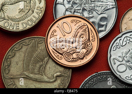 Coins of New Zealand. Maori carved head called koruru depicted in the New Zealand 10 cents coin. Stock Photo