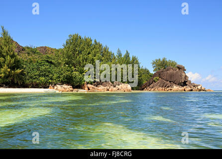 Beautiful Huge granite boulders on beach at Curieuse Island in Indian Ocean. Stock Photo