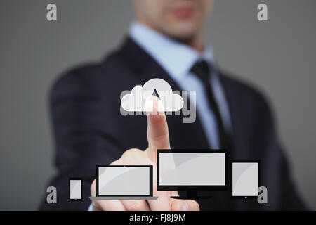 businessman using modern computer, pressing button on virtual screen. Stock Photo