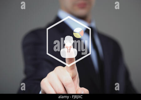 Businessman Touching a Graph Indicating Growth Stock Photo