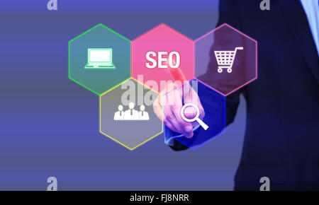 Search Engine Optimization consultant touching SEO button on whiteboard Stock Photo
