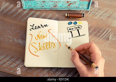 Handwritten text LEARN NEW SKILLS as business concept image Stock Photo