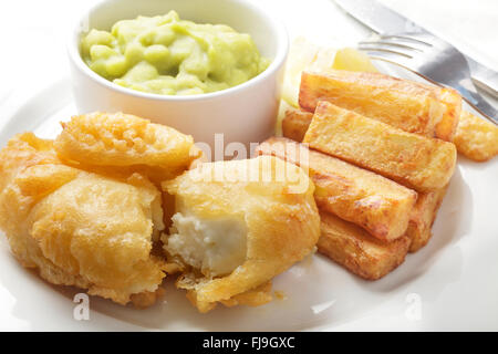 Halloumi battered with chips and mushy peas Stock Photo