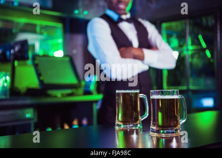 Two glasses of beer on bar counter Stock Photo