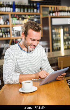 Handsome man using tablet computer Stock Photo