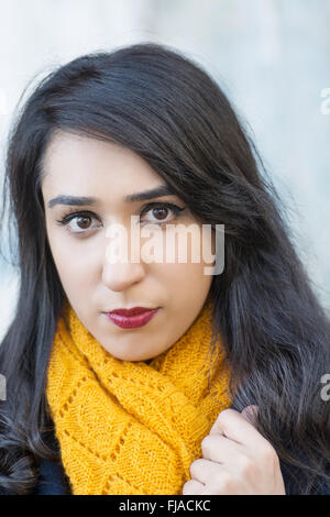 Serious young woman staring outdoors Stock Photo