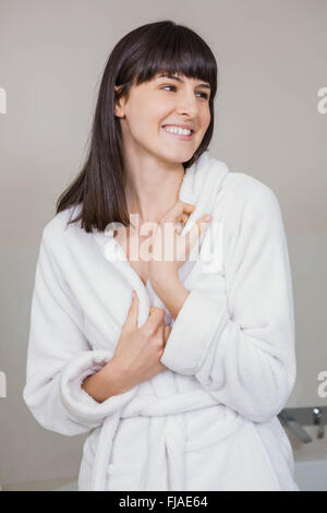 Beautiful young woman in white bathrobe Stock Photo
