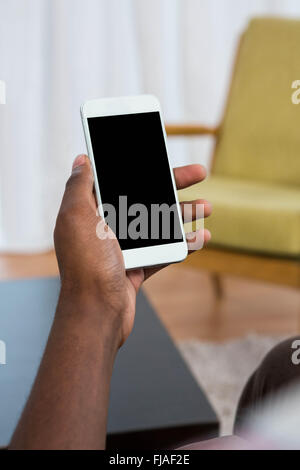 Mans hand holding a phone Stock Photo