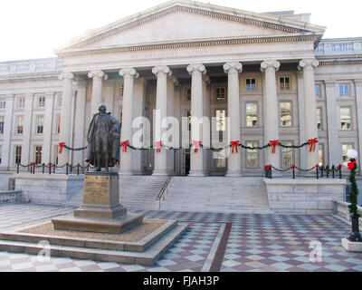 Bronze statue of Albert Gallatin in front of the northern entrance to the Treasury Building in Washington DC. Stock Photo