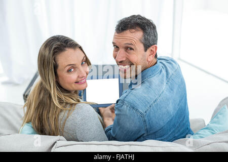 Couple using digital tablet Stock Photo