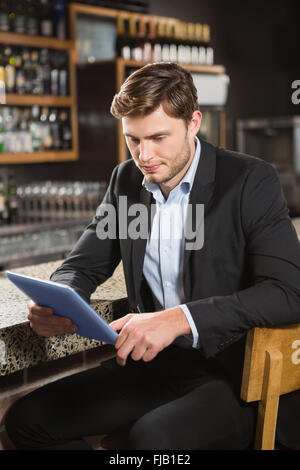 Handsome man using tablet computer Stock Photo