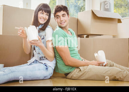 Young couple eating noodle Stock Photo