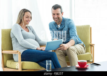 Couple using digital tablet Stock Photo