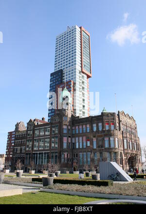 Hotel New York in Rotterdam, The Netherlands.  Art Nouveau style, dating from 1917. Holland America Ship Line. In background skyscraper Montevideo. Stock Photo