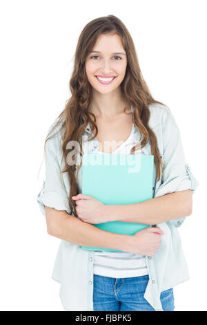 Portrait of female student holding books Stock Photo