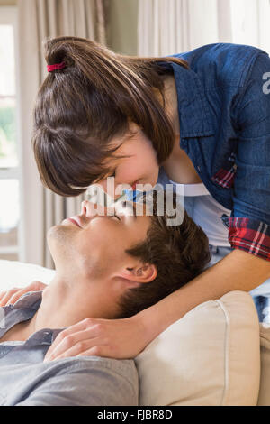 Couple at home relaxing on the sofa Stock Photo