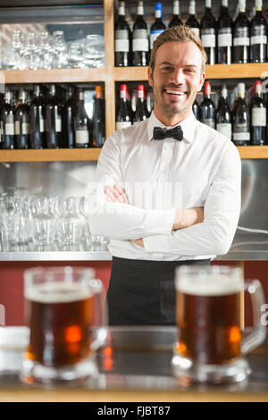 Handsome bar tender crossing his arms Stock Photo