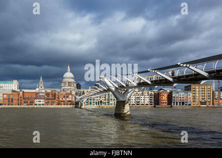 View of Millennium Bridge and River Thames looking towards St Paul's Cathedral, London, England, UK Stock Photo