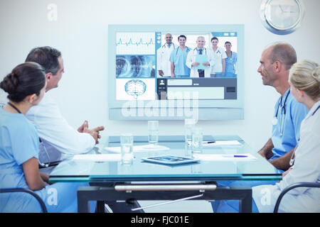 Composite image of team of doctors having a meeting Stock Photo