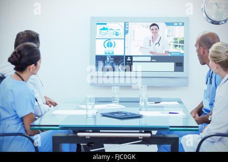Composite image of team of doctors having a meeting Stock Photo