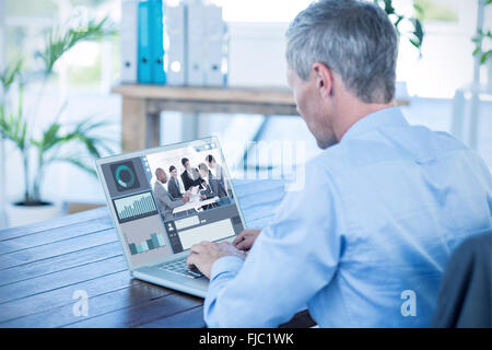 Composite image of screen with graphs Stock Photo