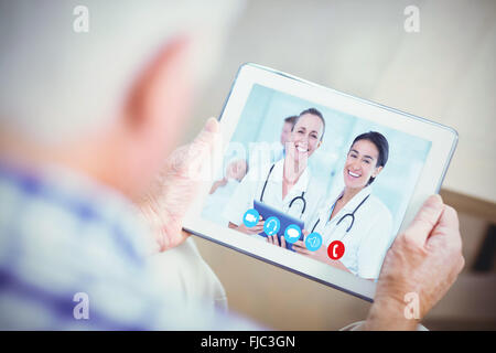 Composite image of nurses with tablet pc Stock Photo