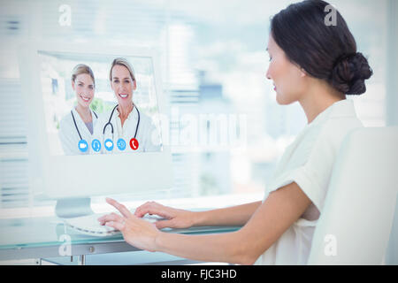 Composite image of blonde doctors standing together Stock Photo