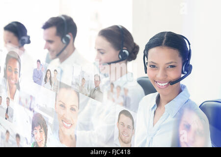 Composite image of business people with headsets using computers Stock Photo