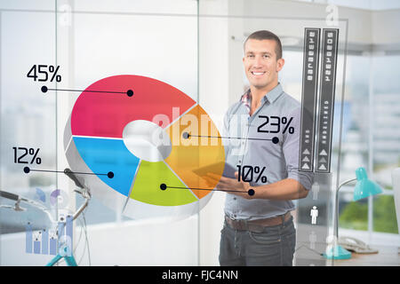 Composite image of handsome businessman using digital tablet over white background Stock Photo